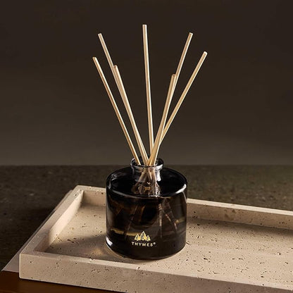 Thymes Petite Oil Reed Diffuser Set – Includes Reeds, Fragrance Oil & Glass Bottle – Luxury Scent Diffusers for Home Decor –Fresh Evergreen, Smoky Wood & Golden Amber (Noir Woods, 4 fl oz)